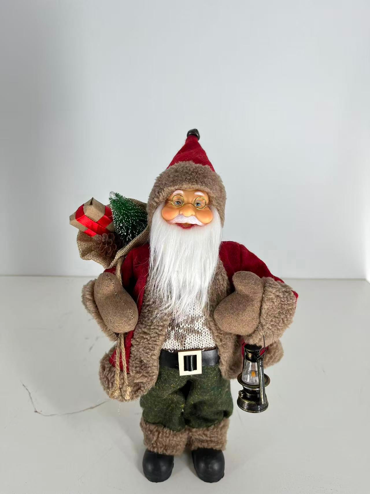 Santa Claus holding Gift Bag and Lamp