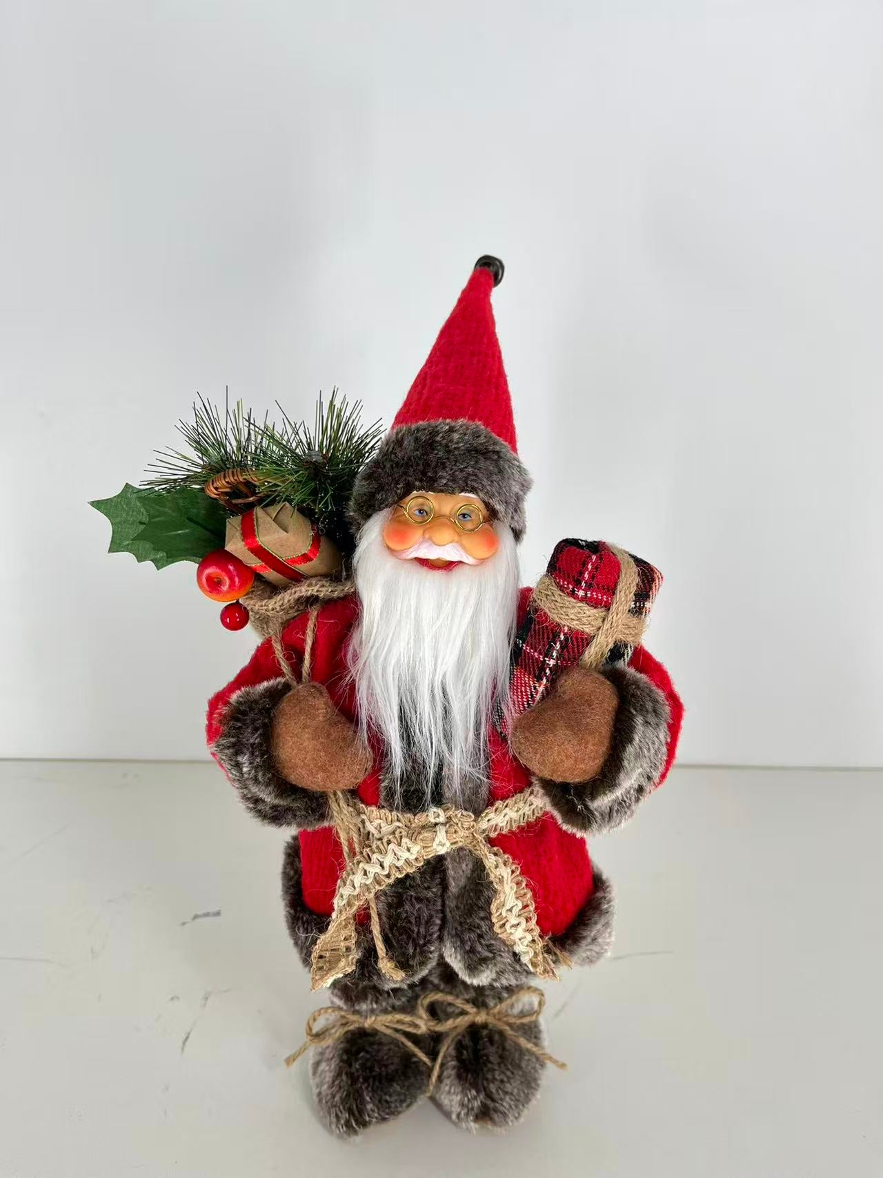 Santa Claus holding Present and Gift Bag