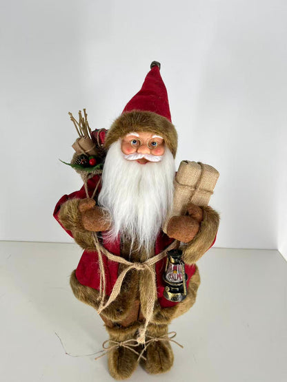 Santa Claus holding Present and Gift Bag