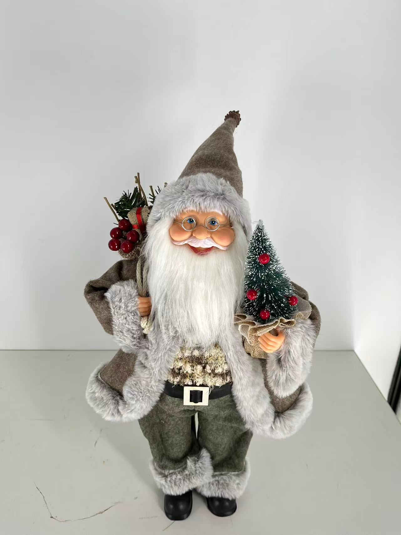 Santa Claus holding Gift Bag and Christmas Tree