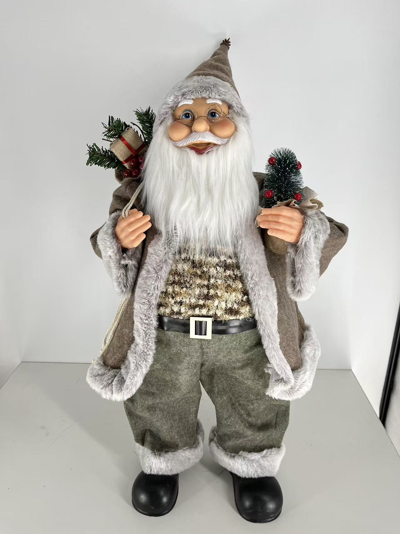 Santa Claus holding Gift Bag and Christmas Tree