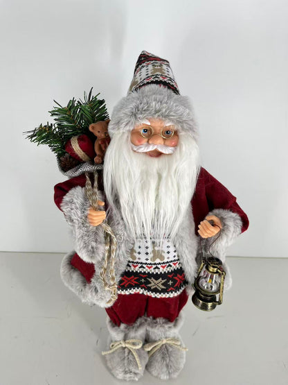 Santa Claus holding Gift Bag and Lamp