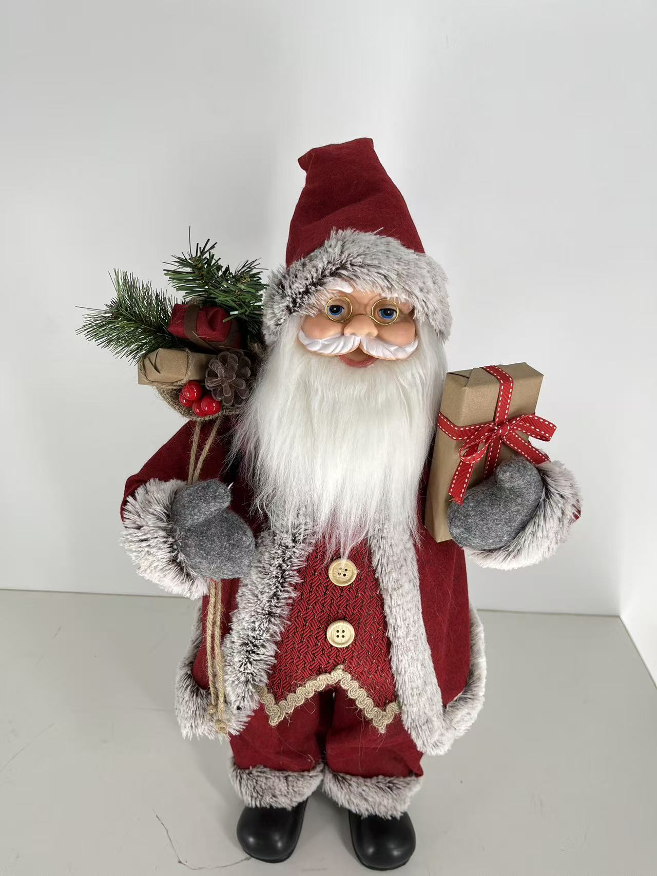 Santa Claus holding Present and Gift Bag