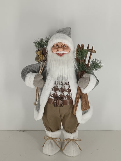 Santa Claus holding Gift Bag and Skiing Gear
