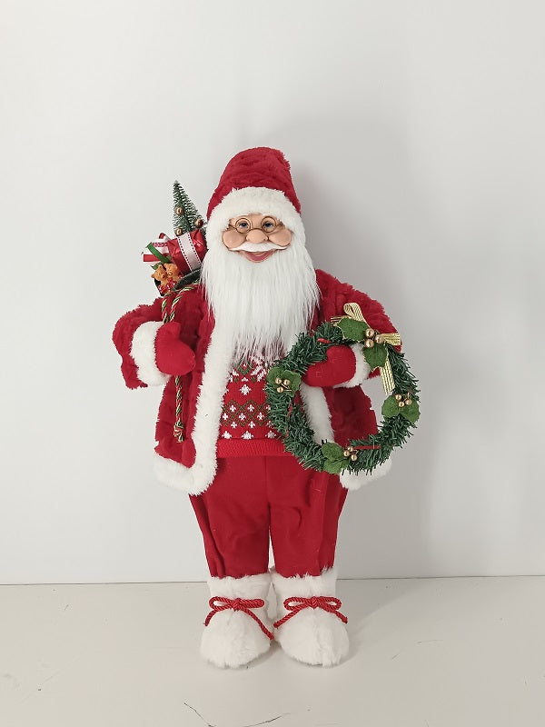 Santa Claus holding Gift Bag and Christmas Wreath
