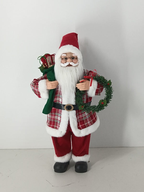 Santa Claus holding Gift Bag and Christmas Wreath