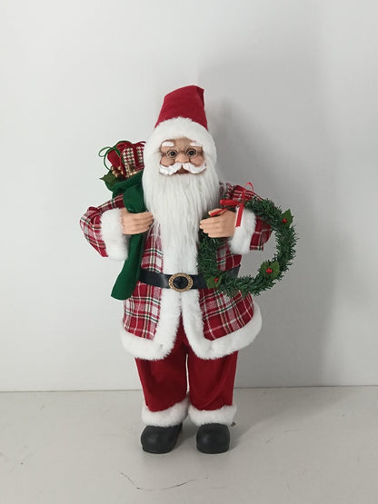 Santa Claus holding Gift Bag and Christmas Wreath