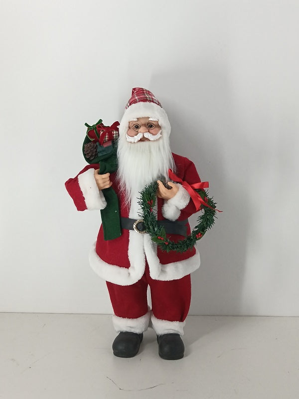 Santa Claus holding Gift Bag and Christmas Wreath