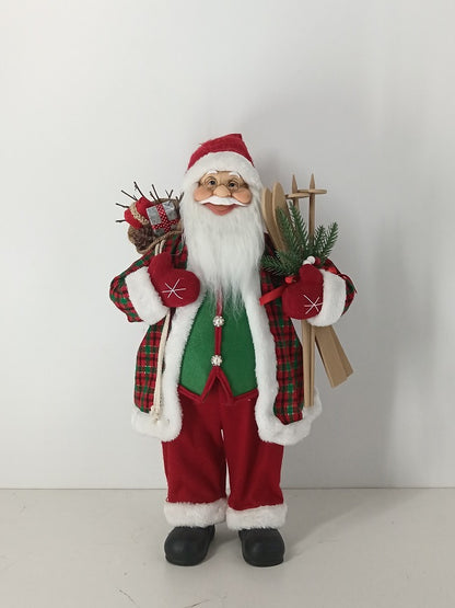 Santa Claus holding Gift Bag and Skiing Gear