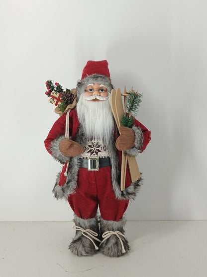 Santa Claus holding Gift Bag and Skiing Gear